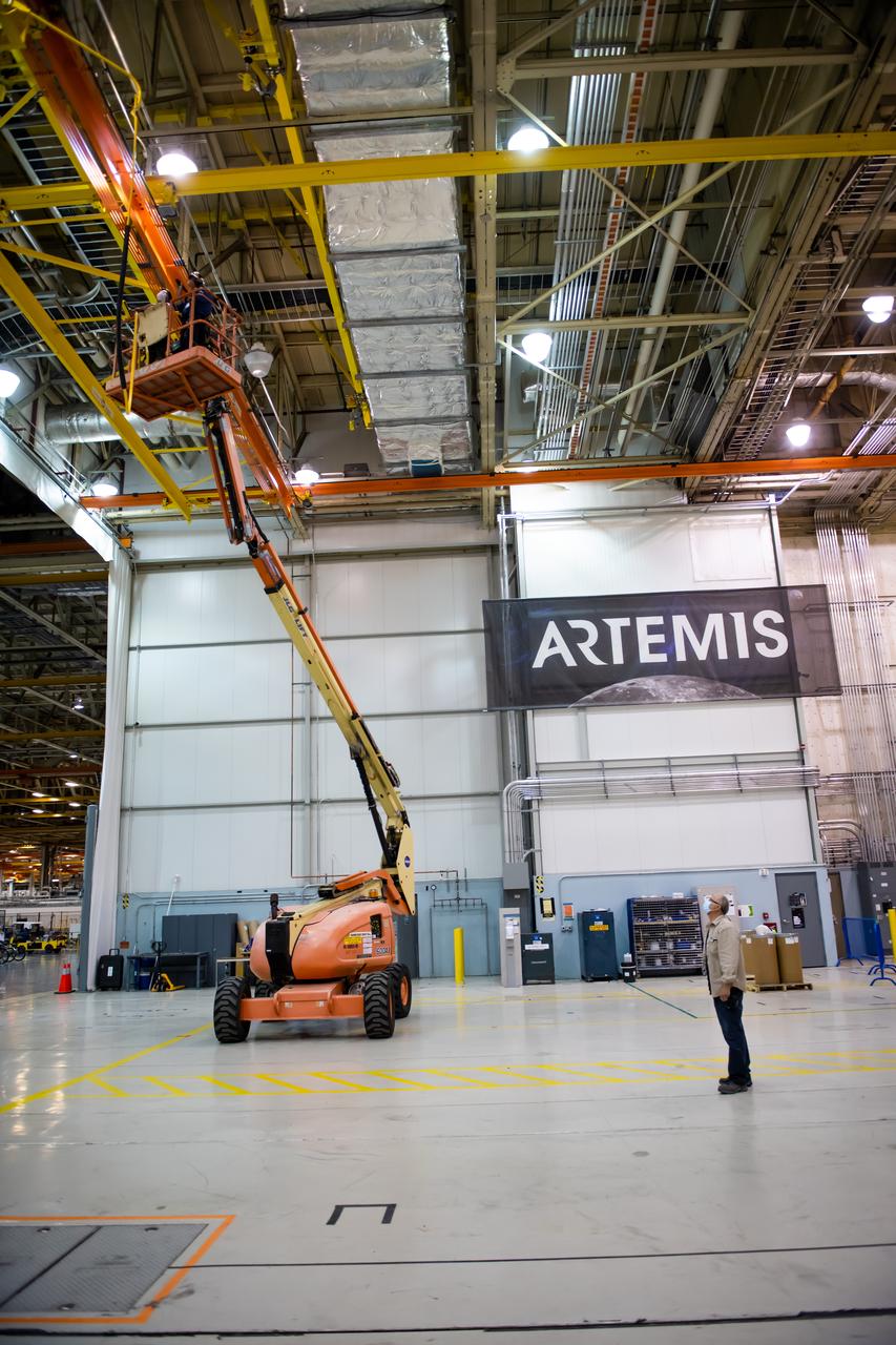 Employees wear personal protective gear at  Michoud Assembly Facility as the facility transitioned to Stage 3 of NASA’s Framework for Return To On-Site Work. Employees wear the appropriate personal protective equipment (PPE) and/or cloth face coverings as required for assigned tasks. Access to the facility is limited to authorized personnel working on mission-critical tasks that must be conducted onsite. Mission-critical tasks include slowly and methodically resuming Space Launch System (SLS) Core Stage and Orion production activities, particularly critical path deliverables to support the Artemis Program, at a pace that limits personnel and follows federal guidelines for social distancing and use of personal protective equipment such as face masks. For more information about SLS, visit nasa.gov/sls.